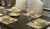 A stylish dining area featuring a modern dining table, elegant dining chairs, and a sophisticated setup.