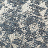 Elegant cushion with dimensional jacquard design in blue and silver.