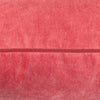 Decorative cushion in rich raspberry hue.