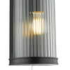 Anund Bathroom Wall Light Matt Black close view picture of the ribbed glass shade