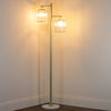 Modern floor lamp with gold and marble accents.
