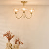 Cognac 3 Light Semi-Flush Satin Gold and Champagne Ribbed Glass life style picture with turned on light