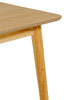 Minimalist dining table crafted from natural oak wood.
