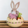 Adorable Easter Bunny Baby Girl in Egg figurine for festive Easter decoration.