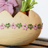 Whimsical Easter Bunny Baby Girl in Egg decor for spring celebrations.