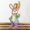 Whimsical Easter decoration featuring a bunny holding carrots, 29cm tall.

