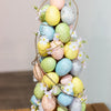 Charming tabletop Easter decoration featuring pastel ornaments.