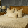 F+H Quilted Velvet Throw Mocha 130x270 close view picture with a mocha cushions