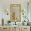 Chic Living Room Mirror with Golden Frame Design
