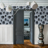 Stylish Graham & Brown wallcoverings with navy stripes and floral accents.
