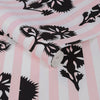 Floral wallpaper with pastel pink stripes for a timeless look.

