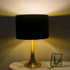 Helena Flared Table Lamp Gold life style photo with switched on light