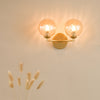 Izzy 2 Light Wall Light Matt Gold With Twisted Amber Glass life style picture