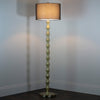 Julia Floor Lamp Gold Black  lamp with a turned on lights