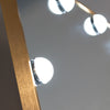 Bedroom mirror with LED bulbs, adding a luxurious glow.
