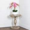 Marwood Pillar Side Table Round life style picture of the table with a flower on it