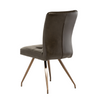 Modern dining chair featuring antique brushed brass legs.