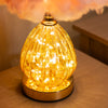 Raya LED Base Feather Lamp Pink close view picture of the turned on LED base