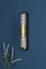 Rhian 2 Light Wall Light Matt Black and Ribbed Glass witha gold accents for modern design