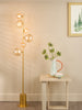 Spiral 6 Light Floor Lamp Matt Gold life style picture with switched on light