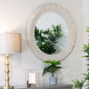 Elegant cream round mirror with beading detail, ideal for your living room.



