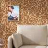 Made Varri Burnt Orange Wallpaper close view picture ofn the wall
