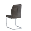 Sleek leather dining chairs with a quilted finish and chrome legs.
