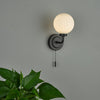 Alrik Bathroom Wall Light Matt Black Opal Glass IP44 life style picture