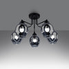 Trendy ceiling lighting fixture with a unique dented glass design
