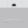 RISA 80 Black LED pendant light in a cozy living room.
