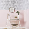Stylish triangle wallpaper featuring a marquetry-inspired silver design
