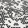 Striking geometric wallpaper featuring abstract triangle designs.
