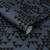 Triangle wallpaper with bold mountain silhouettes in a navy blue hue.
