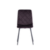Modern kitchen chairs with a curved silhouette and black legs.
