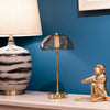 Adjustable brightness USB rechargeable table lamp in gold
