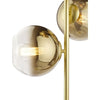 Chic floor lighting with satin gold finish and ombre glass
