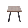 Side profile of the Oakland Coffee Table highlighting the slim tabletop and metal leg design.

