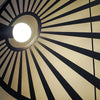 Minimalist Sollux Lighting Pendant Lamp LEHDET Black in a lobby.
