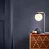 Elegant Graham & Brown wallcovering in deep blue tones

