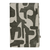 Cozy green Scatterbox Soren Throw blanket draped on a sofa.
