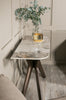 Solid birch legs complement the polished aesthetic.