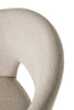 Natural-toned dining room chairs with a rich textured finish.