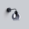 Modern wall lamp with glass and steel design
