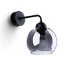 Black steel wall lamp with tinted glass shade

