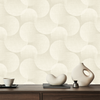 Beige wallpaper with a repeating pattern of large overlapping circles on a textured linen-like background, shown behind a dark wood console table with minimalist ceramic decor.