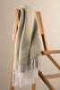 Against a backdrop of natural elements, the Pearl Sage Throw stands out with its earthy sage green tone. The beautifully woven fabric adds a touch of sophistication and elegance to any room. Whether draped over a chair or layered on a bed, this throw instantly transforms your space into a serene retreat, offering both style and coziness.