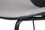 Create a sophisticated dining atmosphere with the Harris Dining Chair in Black. The black faux leather upholstery adds a touch of elegance and complements a variety of interior styles. The padded seat and backrest provide superior comfort, making it perfect for extended dining sessions.