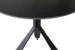 A close-up of the sturdy and durable construction of the Kya Circular Dining Table in 800 Black, highlighting its high-quality materials and craftsmanship. The black finish adds a touch of contemporary flair, making it a stylish choice for both casual meals and formal gatherings.