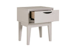 The Luna Bedside Table in Taupe, highlighting its compact size and functional features. The table features a spacious drawer and an open shelf, providing convenient storage space for your bedside essentials.