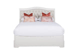 The Mabel Bed in Bone, King Size, highlighting its exquisite craftsmanship and plush texture. The neutral bone color adds a sense of tranquility to the bedroom, while the padded headboard provides comfortable support for sitting up and relaxing.